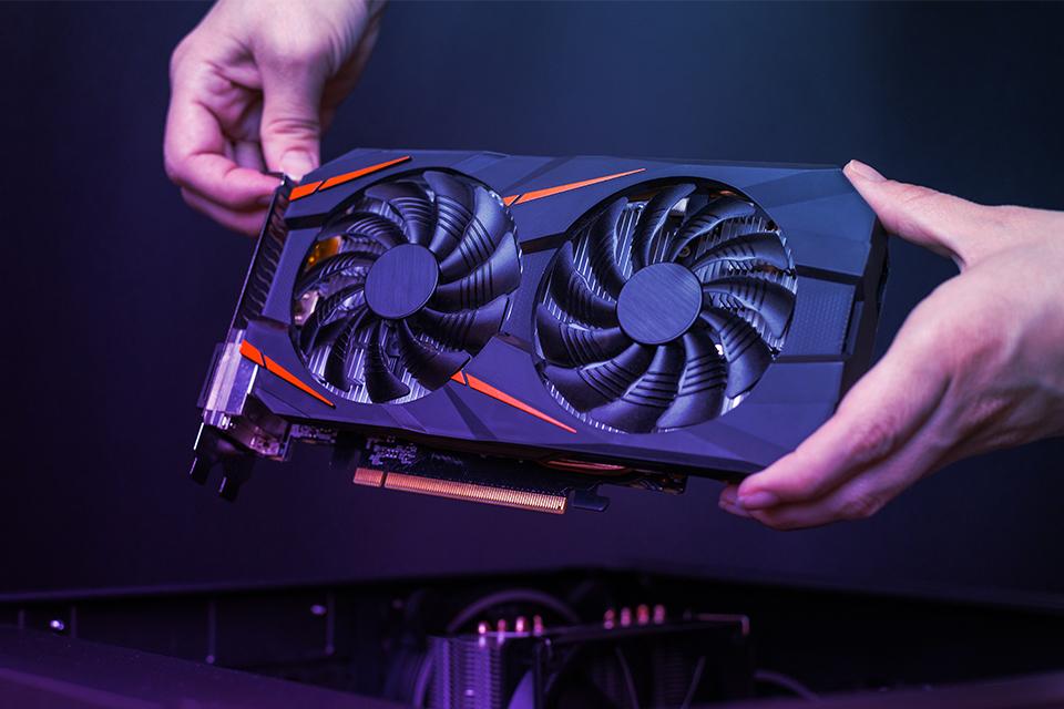 A graphics hard being held.