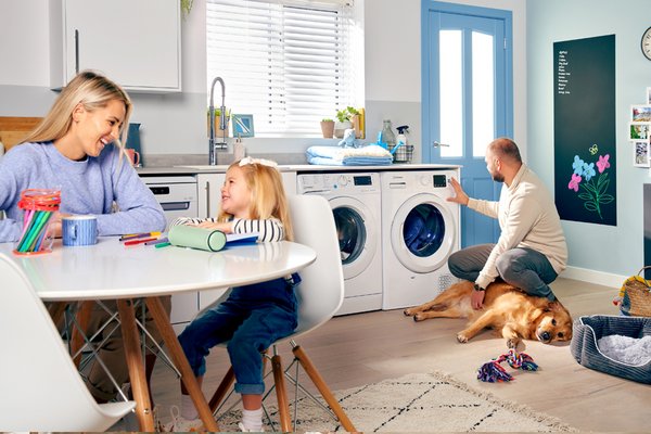 A family spending quality time together in their home equipped with Indesit appliances.