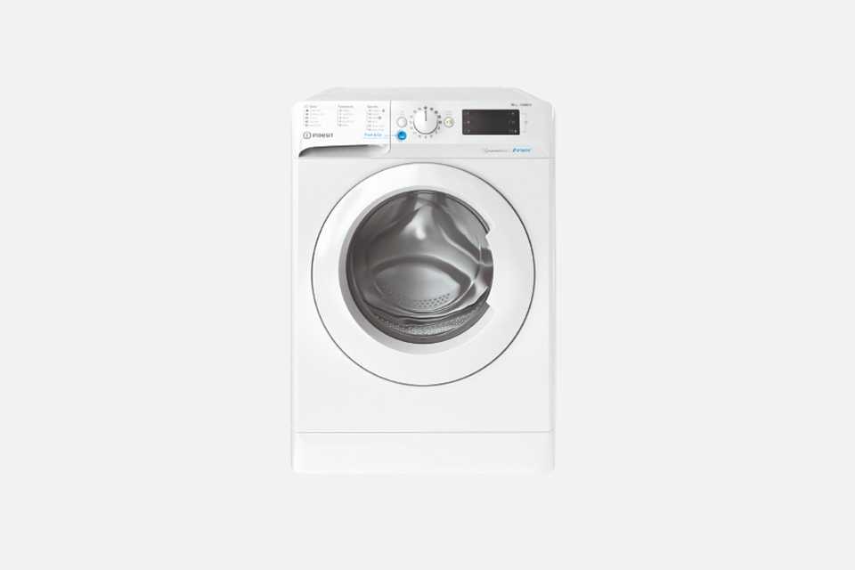 A white Indesit 10kg spin washing machine.