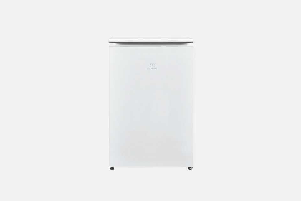 A white Indesit under counter freezer.