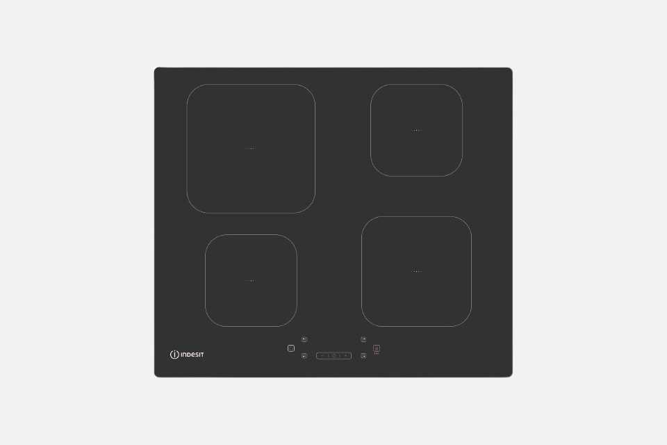A black Indesit electric induction hob.