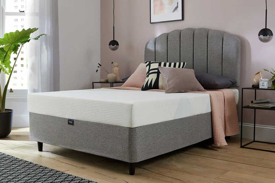 A Silentnight Memory Foam Rolled single mattress in a room.