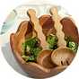 Habitat wooden salad servers in a wooden salad bowl.