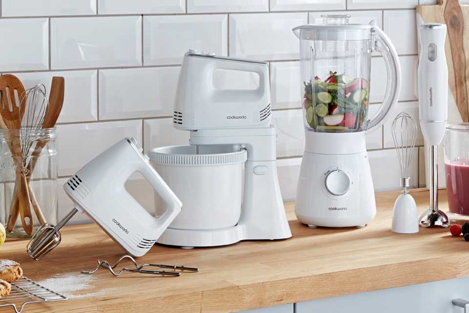 A white Cookworks stand mixer, electric hand mixer with hand and jug blenders on a countertop.