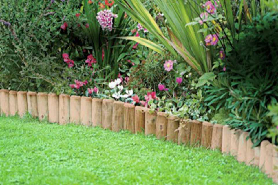 Pack of 2 log roll edging installed in a garden.