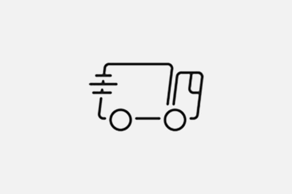 A black outline of a speeding delivery truck against a white background.