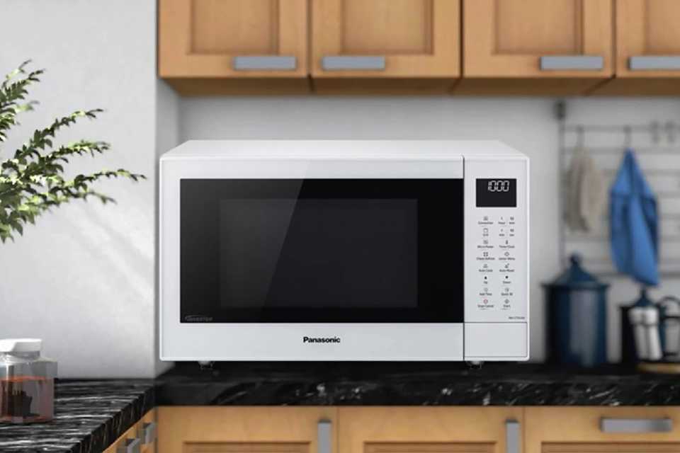 A Panasonic microwave placed on a kitchen counter.