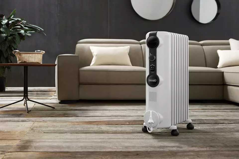 An eletcric heater placed in a living room.