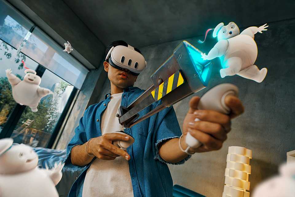 Person using Meta Quest 3 headset in mixed reality with Ghostbusters: Rise of the Ghost Lord visuals showing.