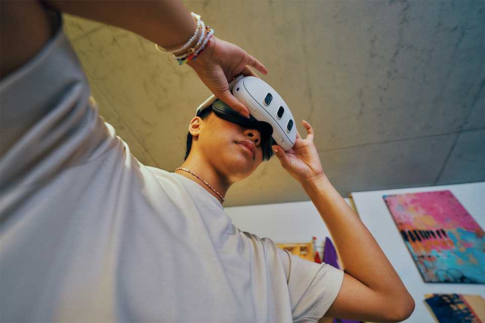 A person wearing Meta Quest 3 headset.