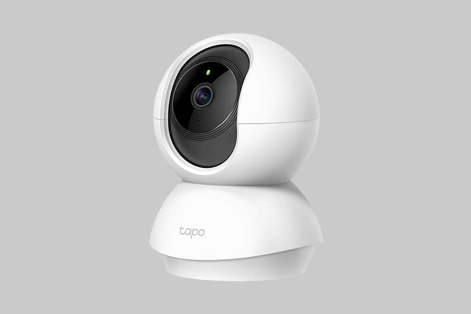 A white TP-Link Tapo pan/tilt Wi-Fi smart indoor CCTV camera.