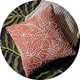 A Habitat Crewel foliage outline cushion in orange.