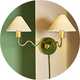 A Habitat Wiggle metal 2 light wall light on a living room wall.