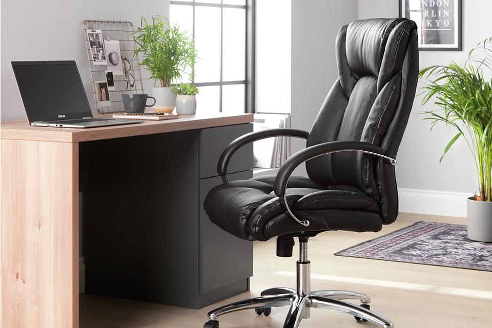 Argos Home leather faced ergonomic office chair in an office space.