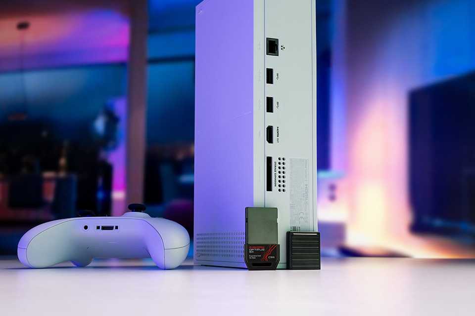SANDISK Xbox gaming storage expansion displayed beside a gaming console.