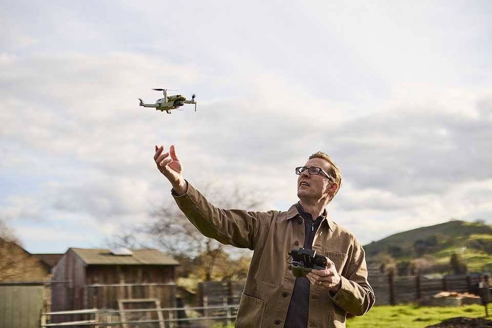 Photographer flying a drone in the neighbourhood.