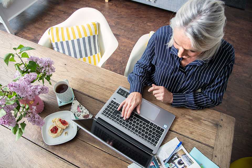 A woman uses a laptop.