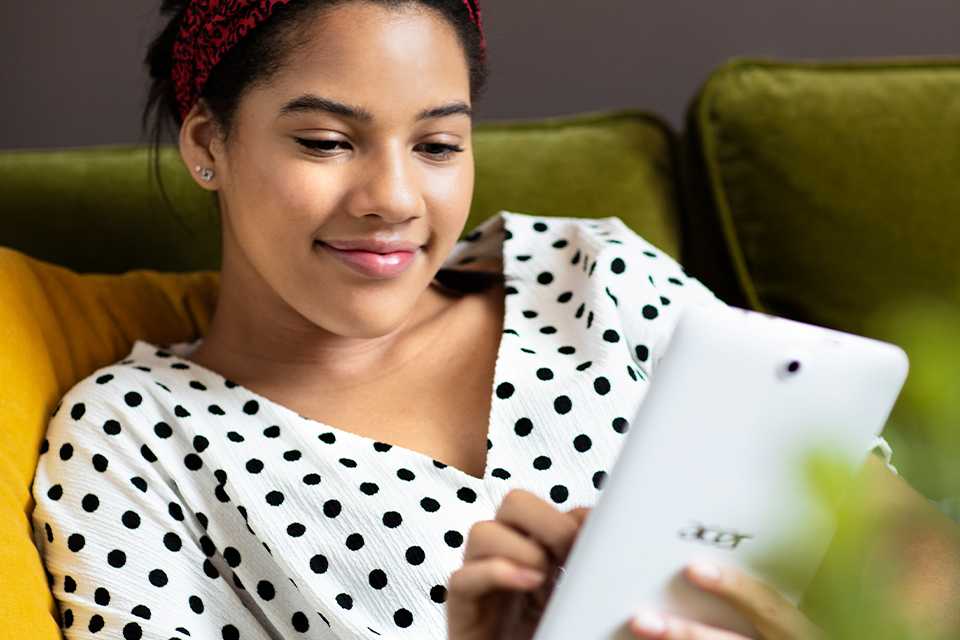 A woman shops using her tablet.