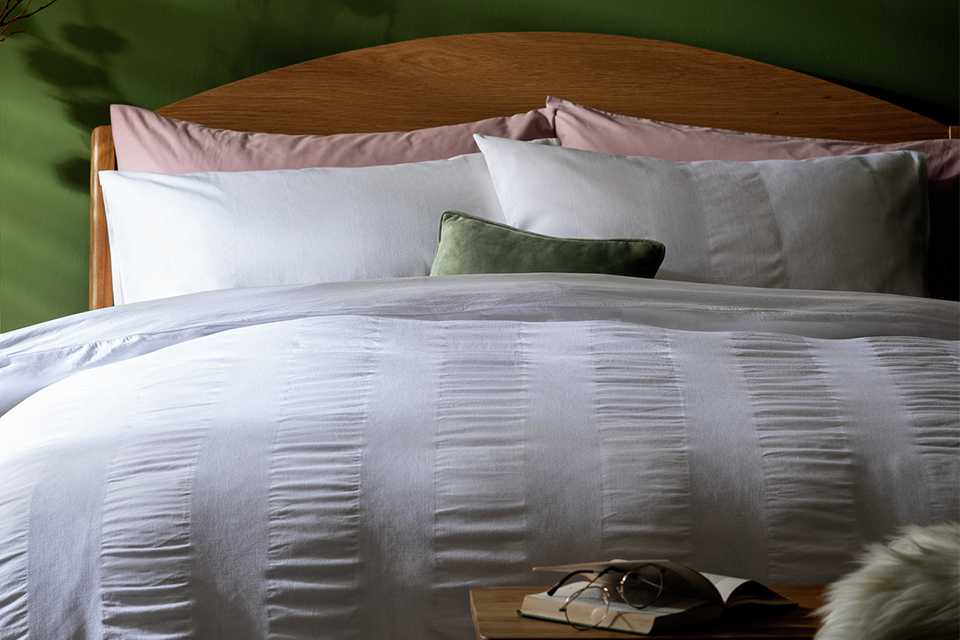 A Habitat mini waffle striped white bedding set.