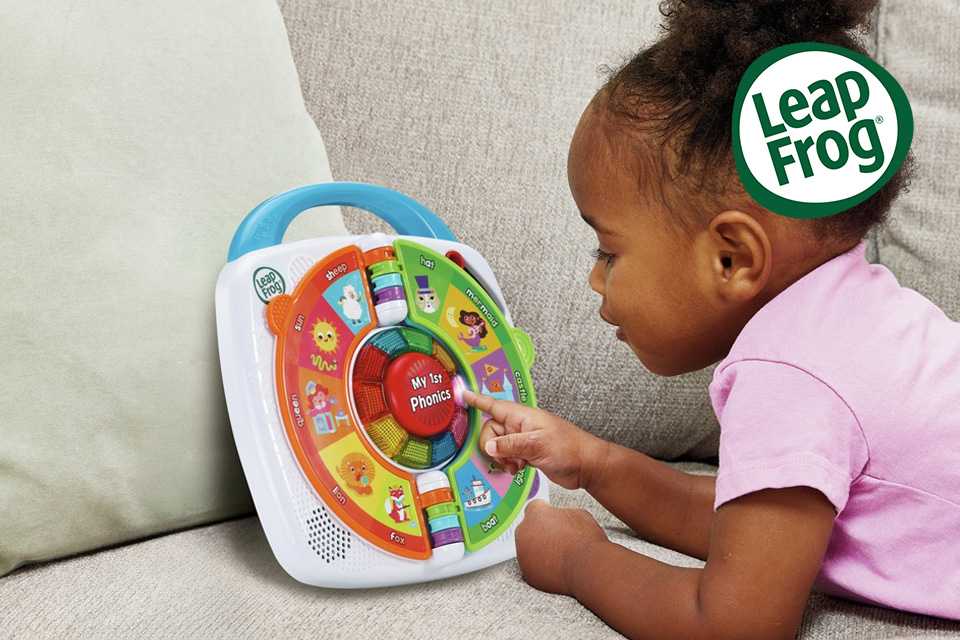 A child playing with a Leapfrog My 1st Phonics: Spin & Learn toy.