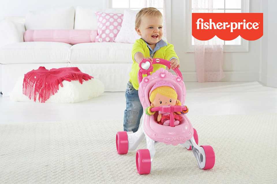 A child playing with a Fisher-Price Princess Musical Stroller and Doll playset.