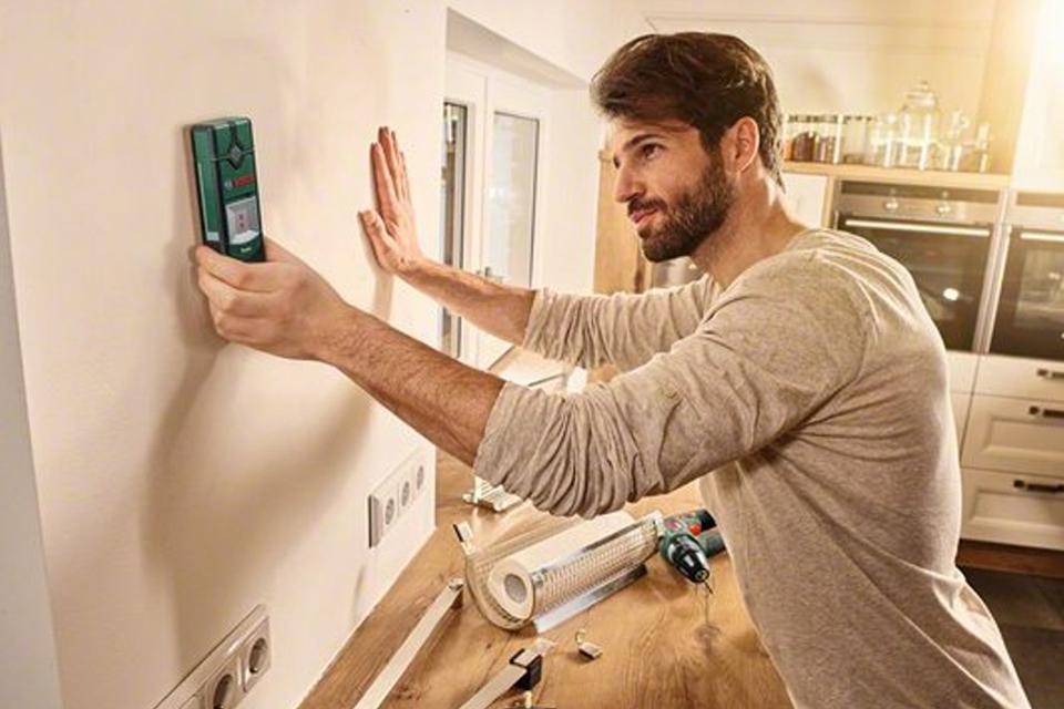 Man using a spirit level.