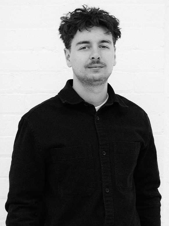 A monochrome portrait of artist Will Hudson.