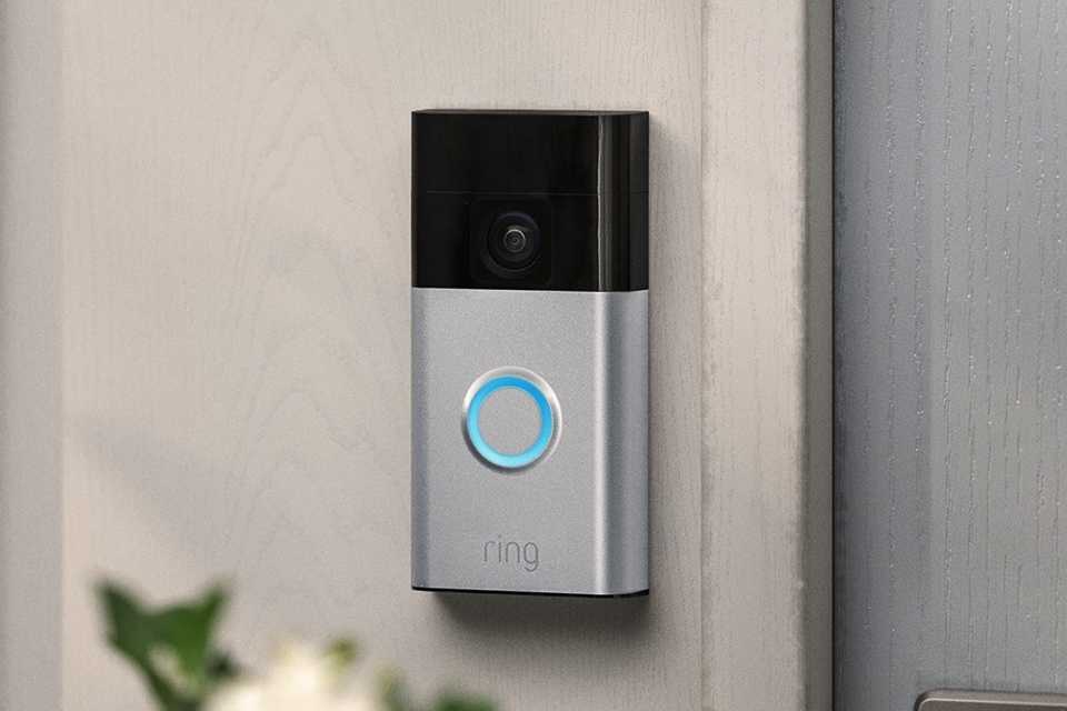 A Ring video doorbell placed outside at doorstep of the house.