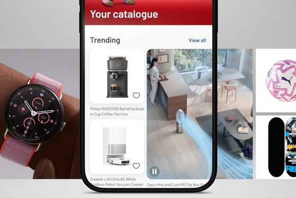 A phone with the Argos App open showing trending products.
