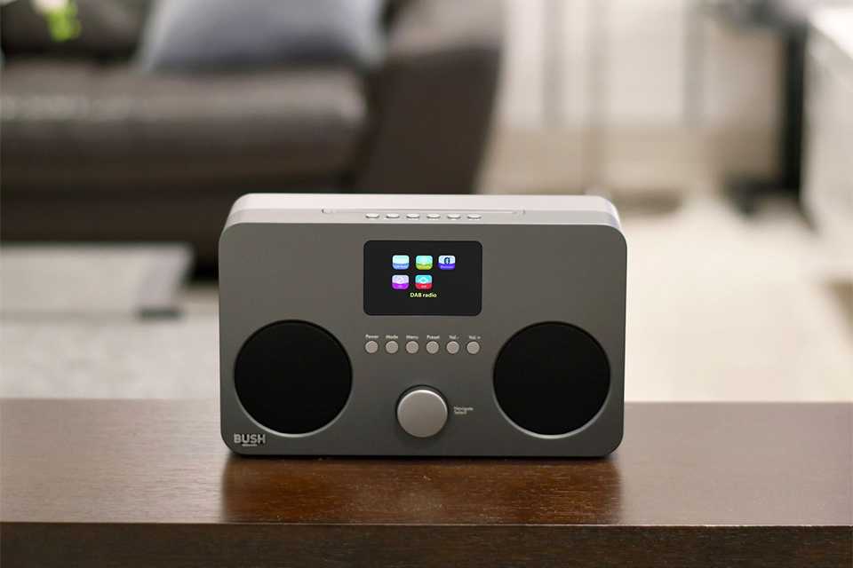 Bush all-in-one CD micro system on a wooden table.