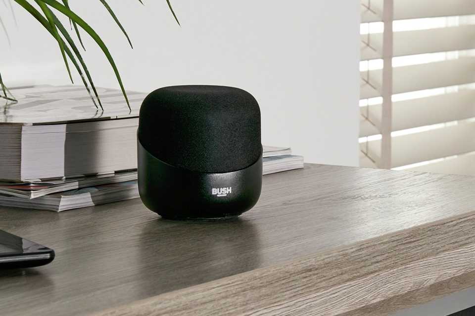 Bush Acorn bluetooth speaker on a table.