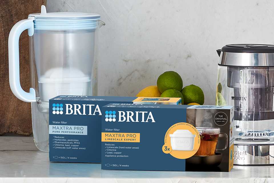 BRITA MAXTRA PRO filter cartridges next to other BRITA products on a kitchen countertop.