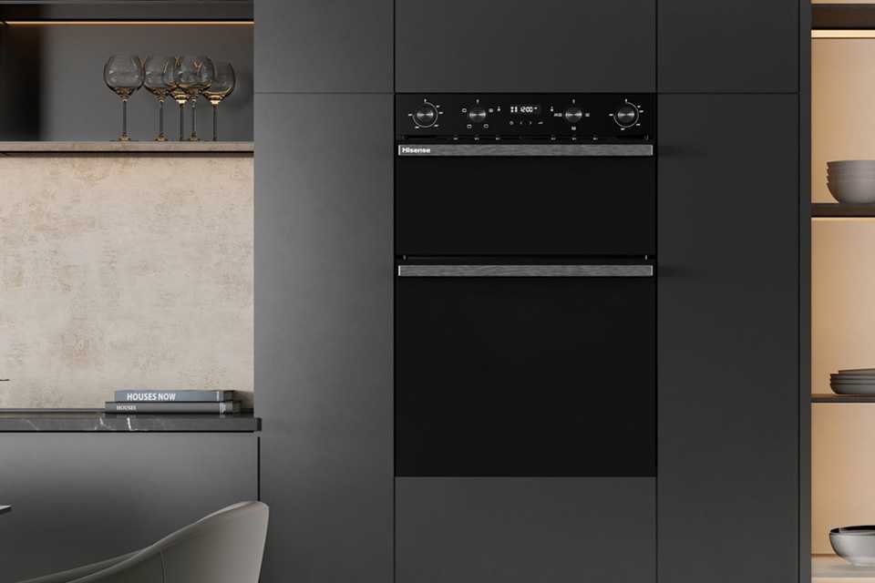 Hisense BID914221CDBG Built In Double Electric Oven in black colour built in a grey kitchen cabinet.