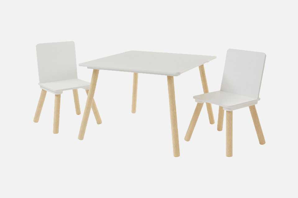 A Liberty House wooden kids table and chair set in white.