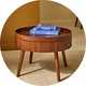 A Habitat Agnes coffee table in walnut with books placed on top of it in a living room.