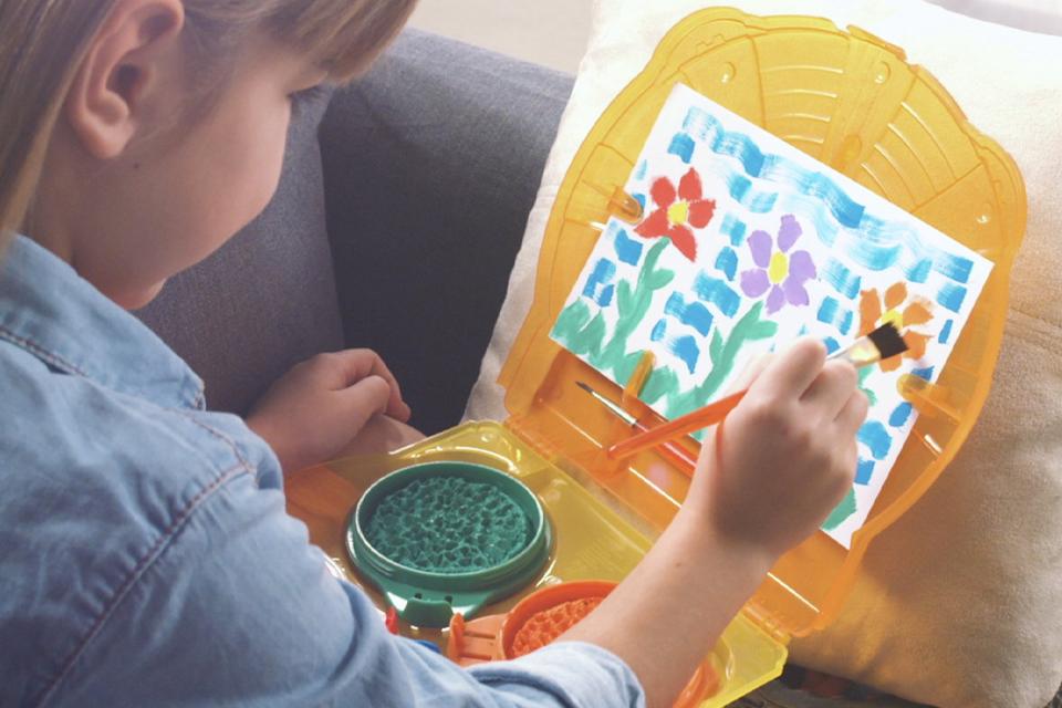 Small child painting.