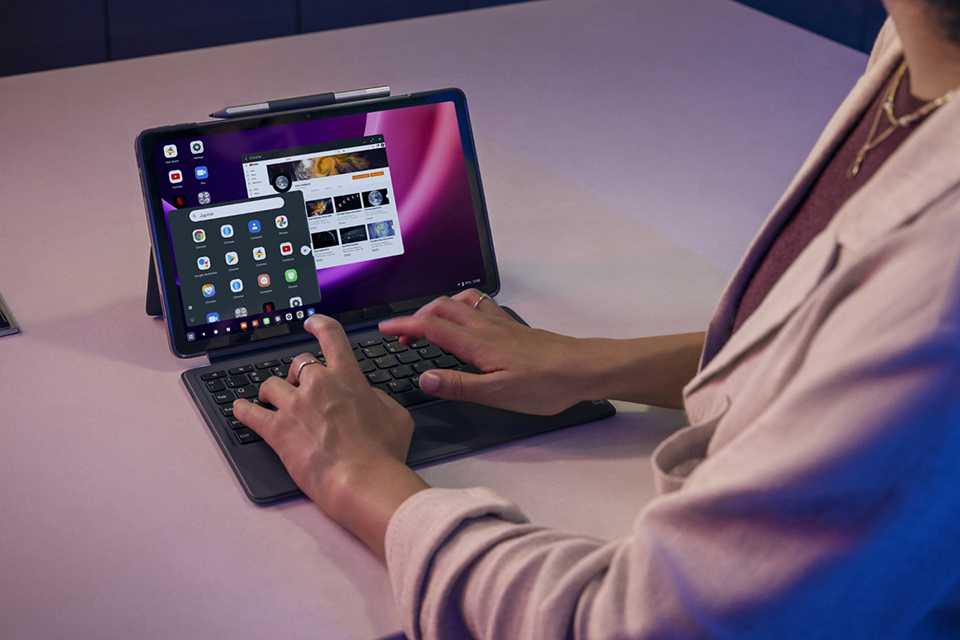 A woman working on Lenovo P11 11.5 Inch 128GB Wi-Fi Tablet Bundle.