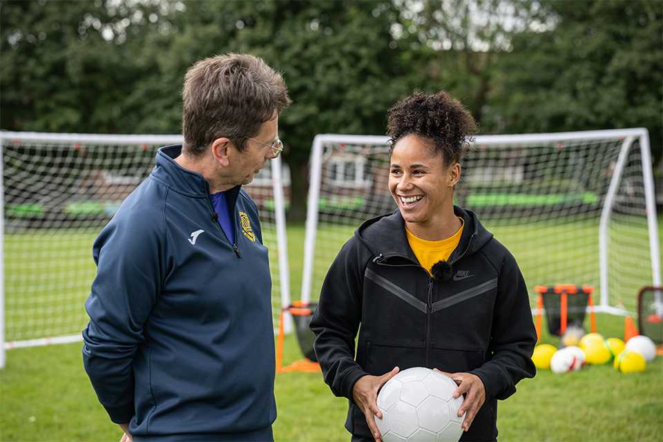 Demi Stokes with her old PE teacher Iain Williamson.