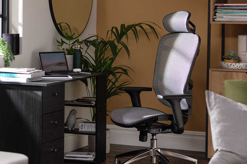 Habitat Ergonomic Office Chair in grey colour kept in an open plan room.