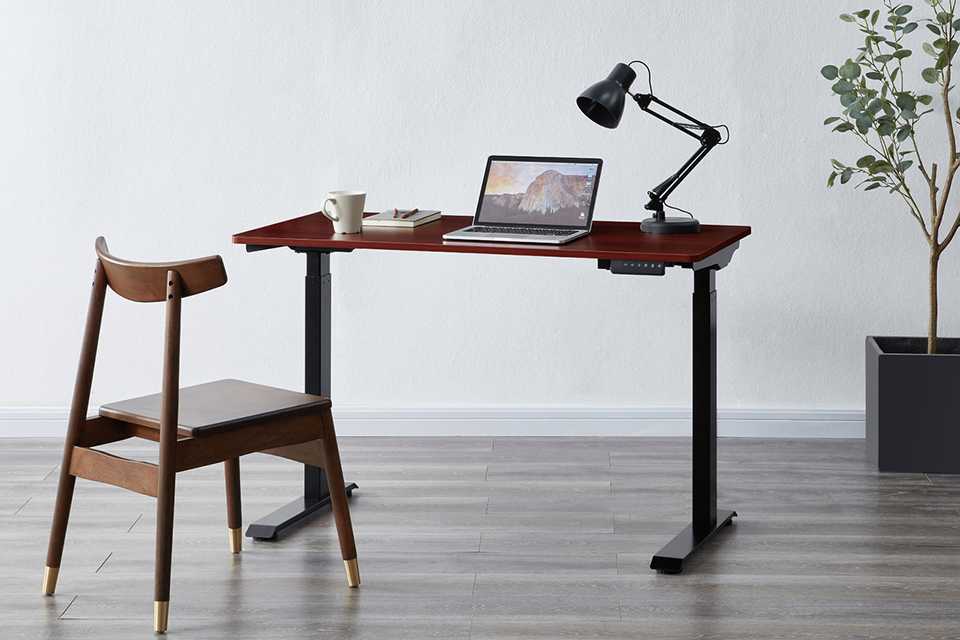 Koble Apollo height adjustable smart office desk in walnut finish.