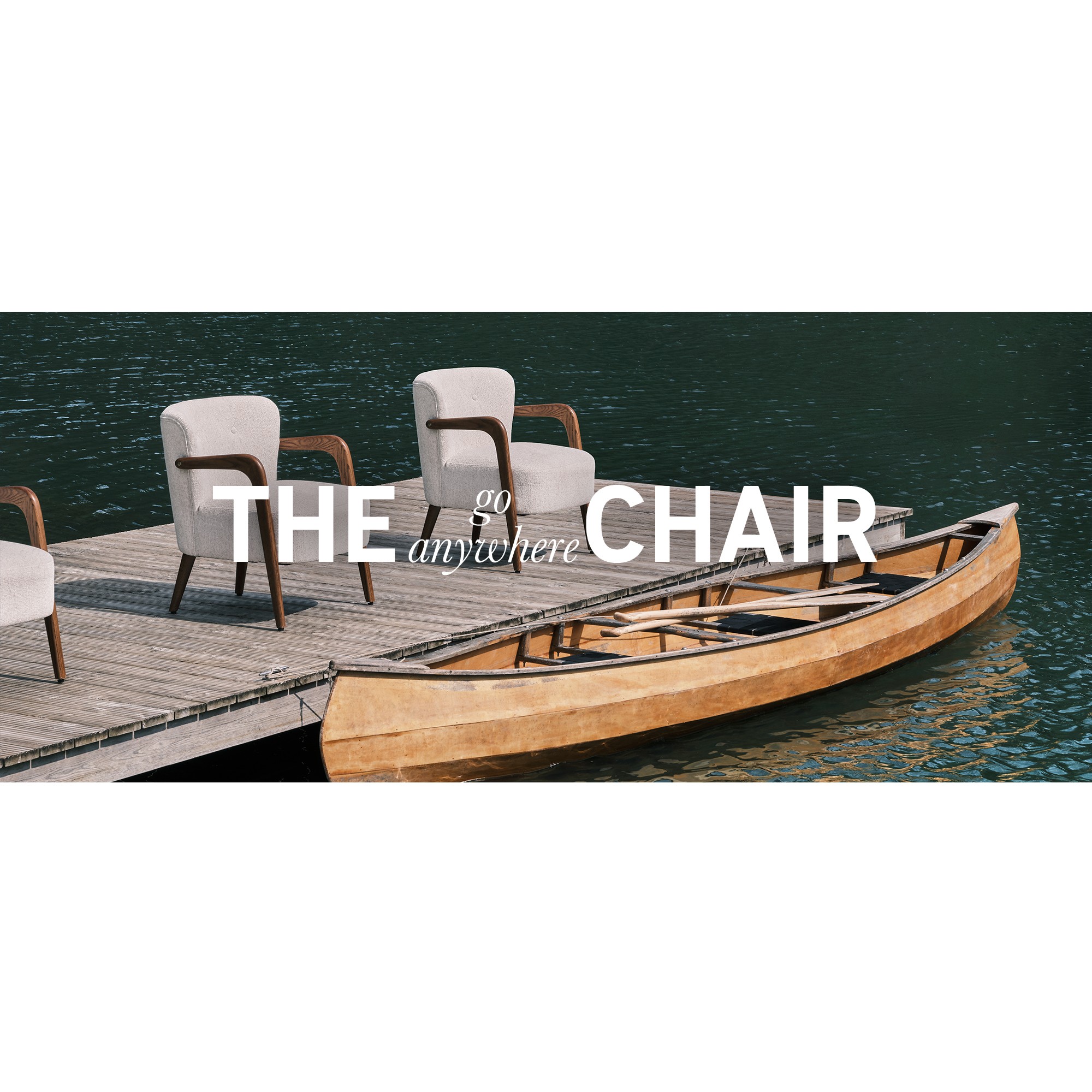 2 Habitat armchairs placed on a deck by a lakeside.