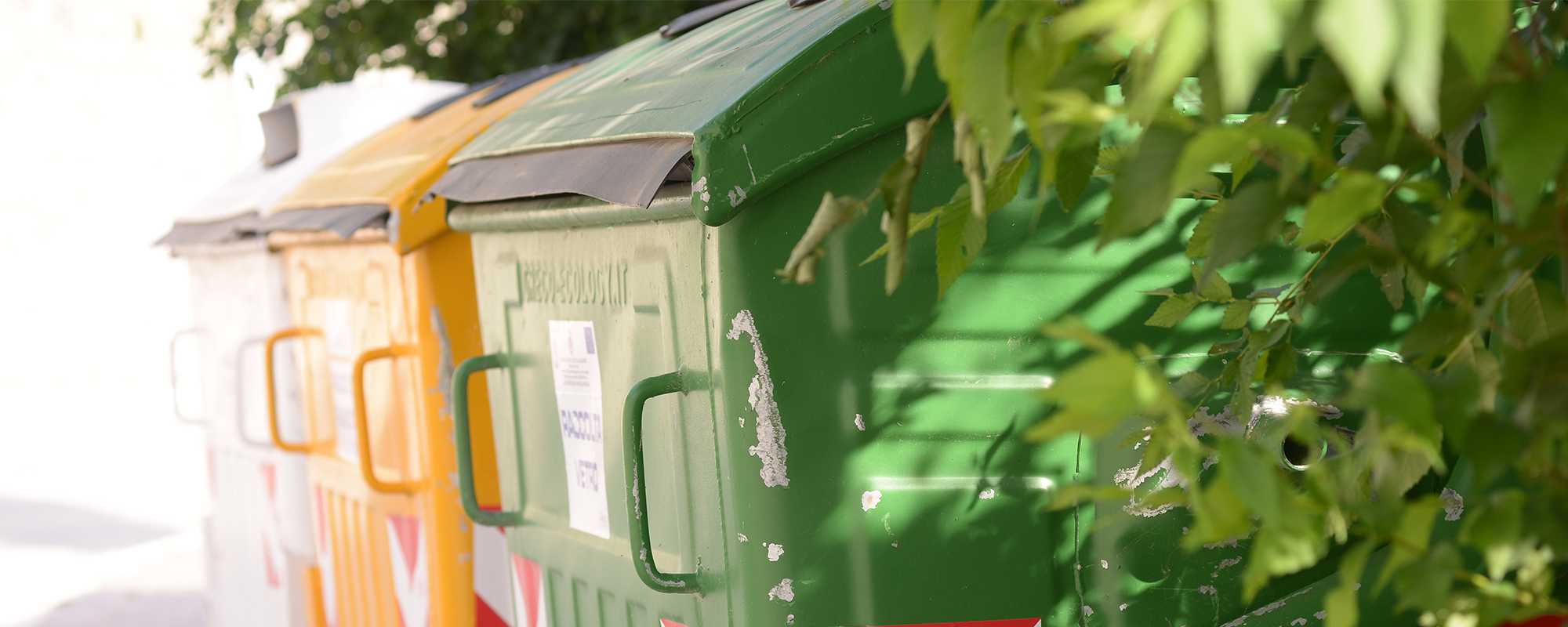 A green and yellow disposal bin.