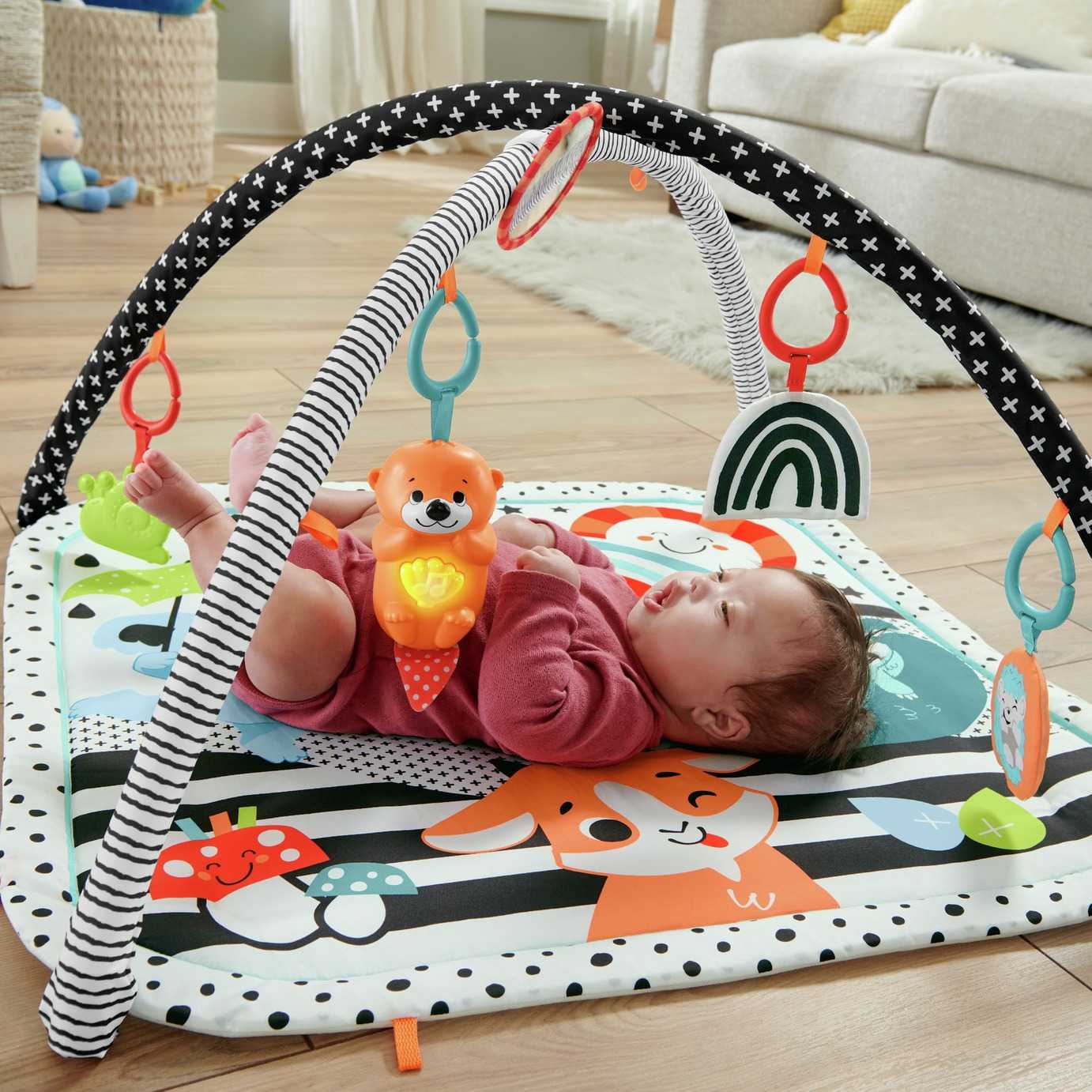 A baby on a playmat.