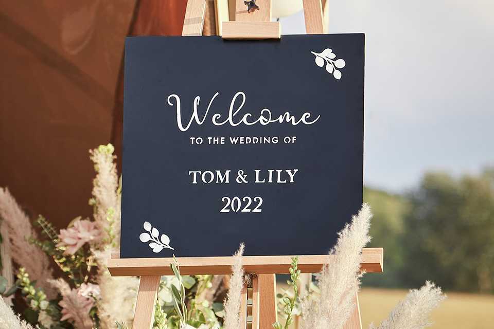 Ginger Ray XL Chalk Sign Board placed outdoors.