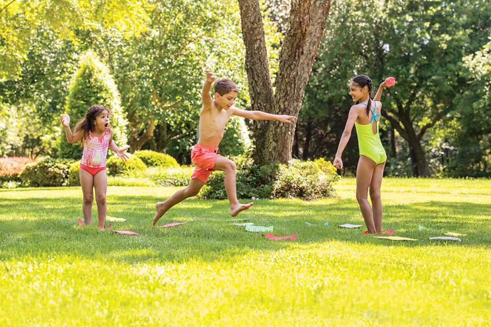 Children playing games in a sunny park.