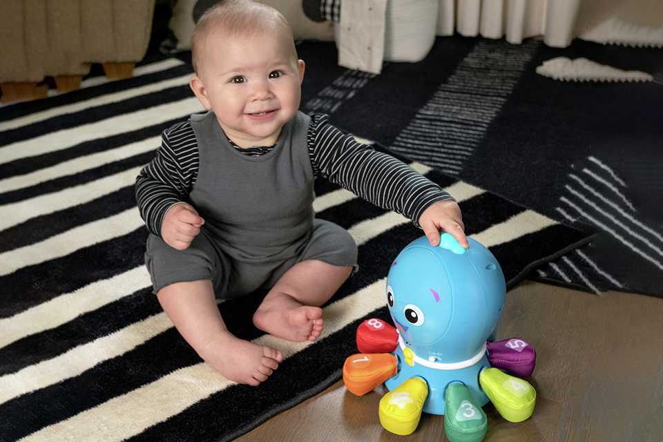 A boy playing with a toy.