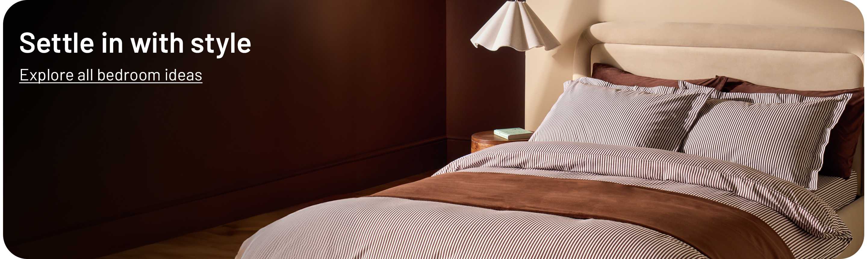 Habitat Cocoa Oxford Edge bedding displayed on a beige upholstered bed.