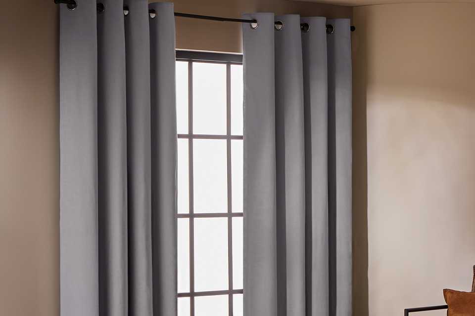 Habitat With Linen Blackout Eyelet Curtain in dove grey.