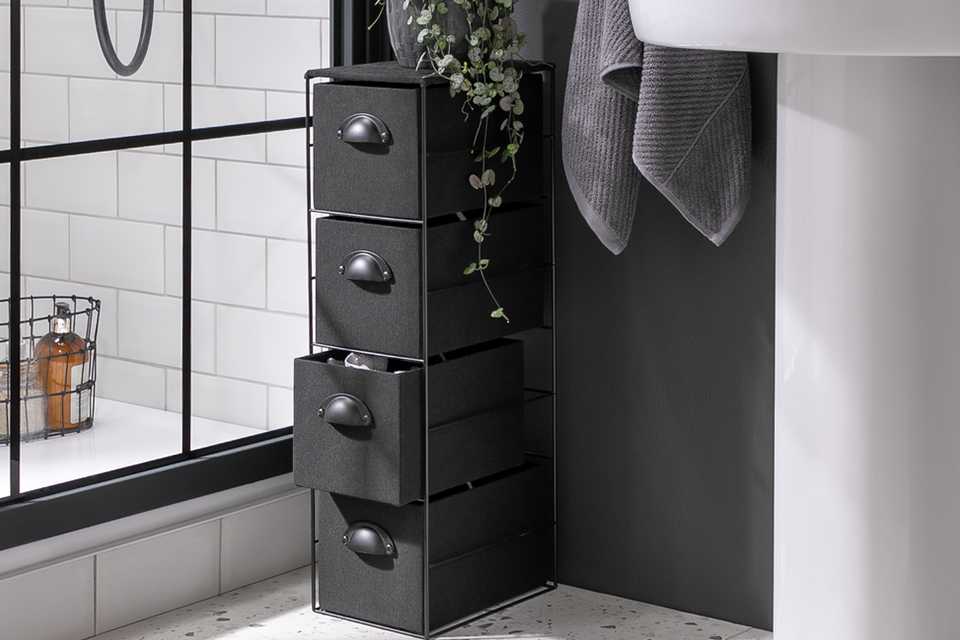 A Habitat Black Fabric Storage Tower near a bathroom screen.