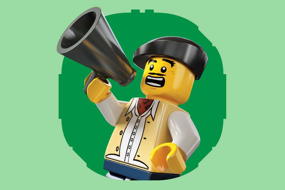 LEGO® minifigure shouting into a megaphone on a green background.